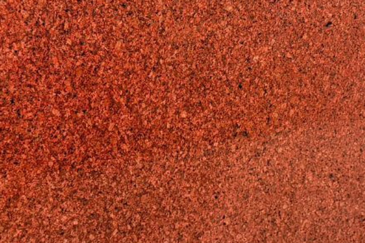 Jhansi Red granite surface, polished